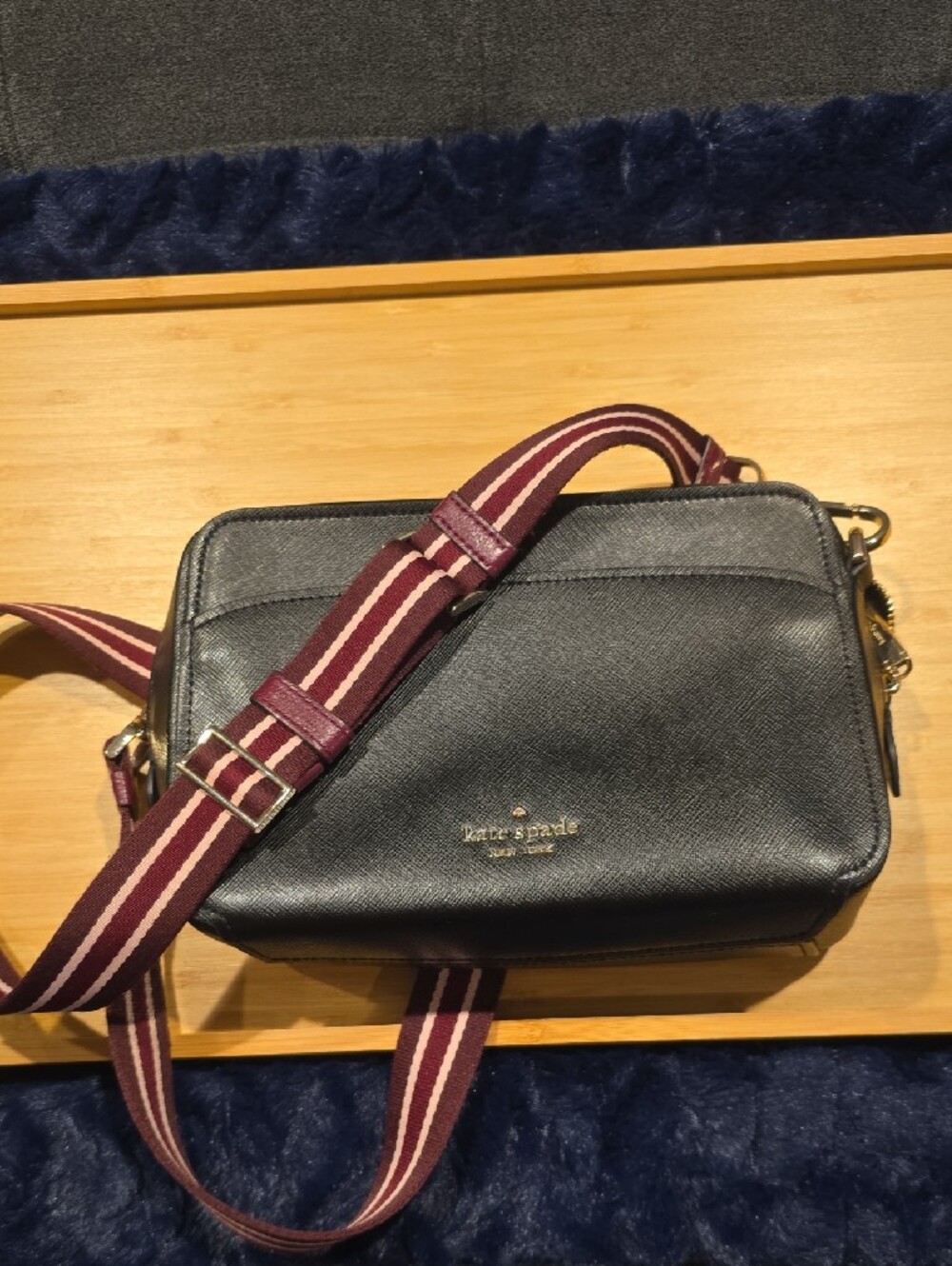 kate spade Lauryn black leather camera bag with burgundy striped strap